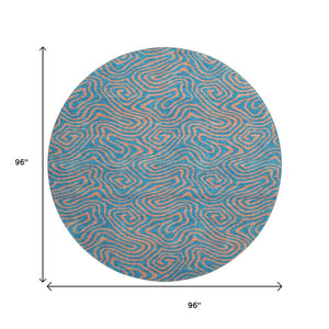 HomeRoots 8' Teal and Peach Abstract Washable Round Rug - Durable, UV-Protected, Perfect for Family Spaces! 680990