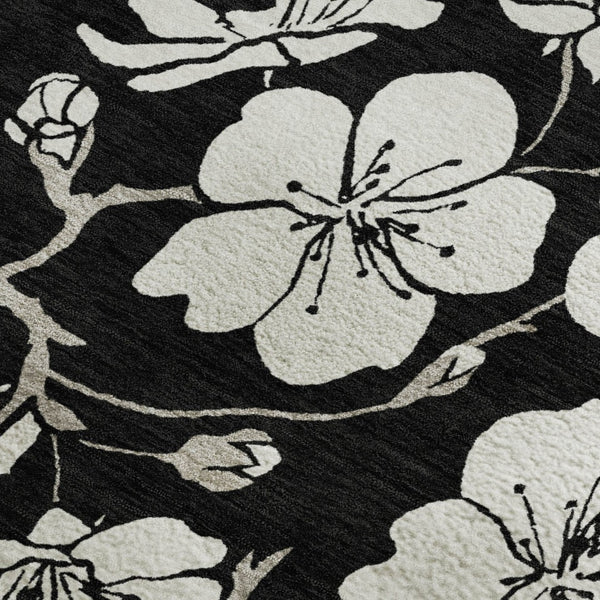 HomeRoots 5' X 8' Black and Ivory Floral Area Rug - Washable, UV Protected, Durable Design for High-Traffic Homes 681013