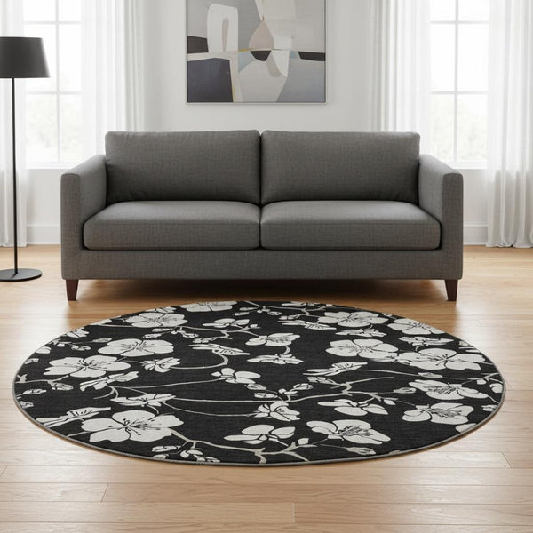 HomeRoots 8' Black and Ivory Floral Round Rug - Durable, Washable with UV Protection for Stylish Living Spaces 681014
