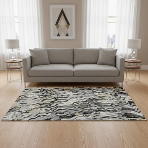 HomeRoots 5' X 8' Abstract Area Rug in Black, Gold & Ivory - Washable, UV Protected, Durable for High Traffic Homes 681421