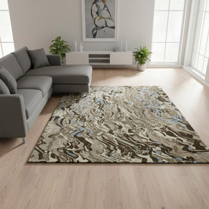 HomeRoots 9' X 12' Modern Abstract Washable Area Rug in Taupe, Sky Blue & Beige with UV Protection & Stain Resistance 681478
