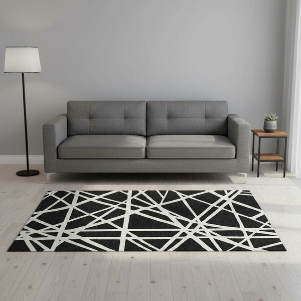 HomeRoots 5' X 8' Black And Ivory Geometric Area Rug - Stylish, Washable, UV-Protected for High-Traffic Spaces 681571