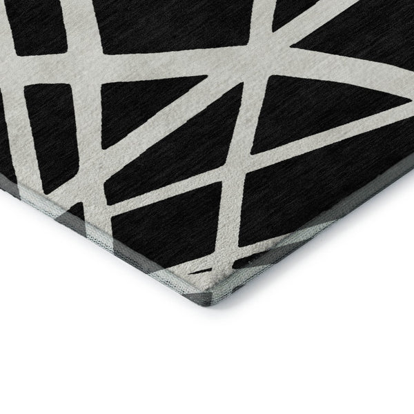 HomeRoots 5' X 8' Black And Ivory Geometric Area Rug - Stylish, Washable, UV-Protected for High-Traffic Spaces 681571