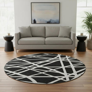 HomeRoots 8' Black & Ivory Geometric Washable Round Rug - Durable, UV-Protected, Ideal for Homes with Kids & Pets 681572