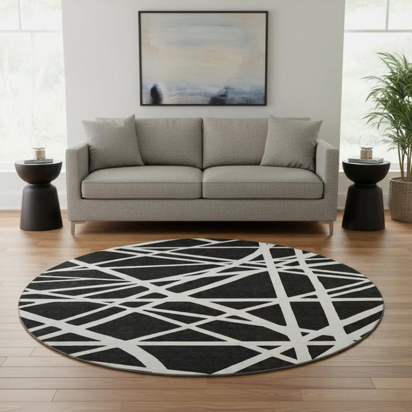 HomeRoots 8' Black & Ivory Geometric Washable Round Rug - Durable, UV-Protected, Ideal for Homes with Kids & Pets 681572