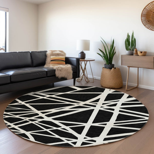 HomeRoots 8' Black & Ivory Geometric Washable Round Rug - Durable, UV-Protected, Ideal for Homes with Kids & Pets 681572