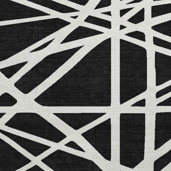 HomeRoots 8' Black & Ivory Geometric Washable Round Rug - Durable, UV-Protected, Ideal for Homes with Kids & Pets 681572