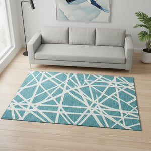 HomeRoots 5' X 8' Teal and Ivory Geometric Area Rug - Washable, UV-Protected, Stylish for Busy Homes! 681643