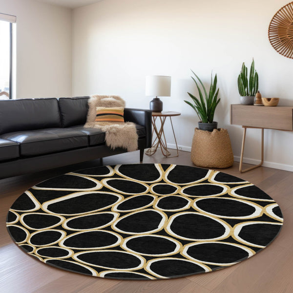 HomeRoots 8' Modern Black, Ivory & Gold Geometric Washable Round Rug with UV Protection & Non-Slip Backing 681668