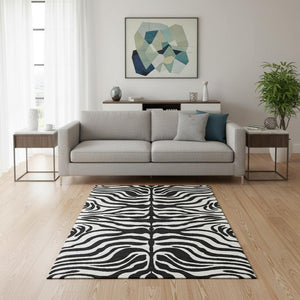 HomeRoots 5' X 8' Black And Ivory Animal Print Rug - Washable, Stain Resistant, UV Protected for High Traffic Areas 681739