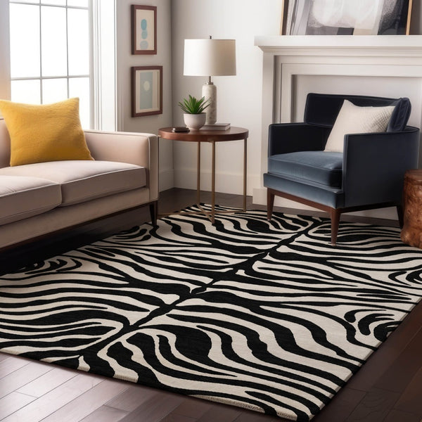 HomeRoots 5' X 8' Black And Ivory Animal Print Rug - Washable, Stain Resistant, UV Protected for High Traffic Areas 681739