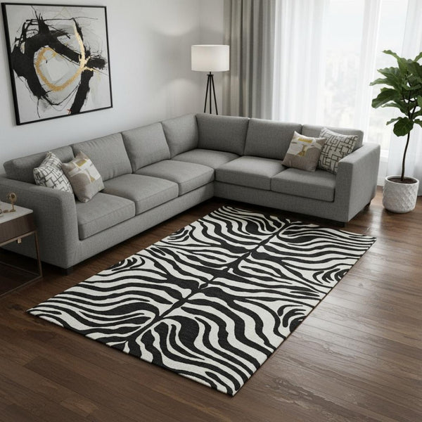 HomeRoots 8' X 10' Black and Ivory Animal Print Rug - Washable, UV Protected, Stylish & Stain-Resistant Design 681741