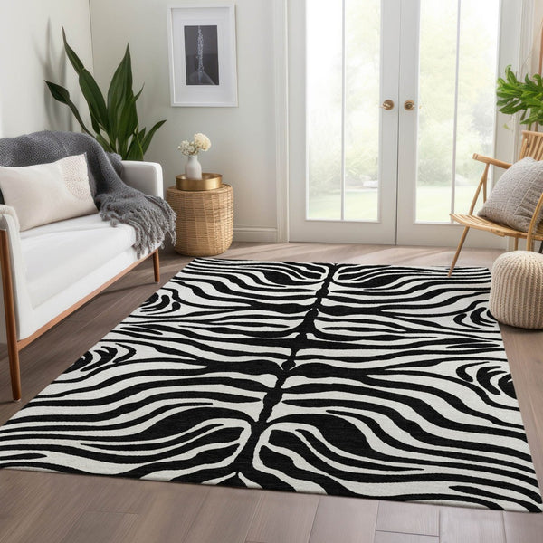 HomeRoots 9' X 12' Stylish Black and Ivory Animal Print Area Rug - Washable, UV Protected, Perfect for Homes! 681742