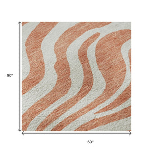 HomeRoots 5' X 8' Coral & Ivory Animal Print Area Rug - Washable, Durable, UV-Protected, Stylish Home Decor 681751