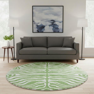 HomeRoots 8' Green And Ivory Animal Print Round Rug – Washable, UV Protected, Durable, Family-Friendly Design 681758