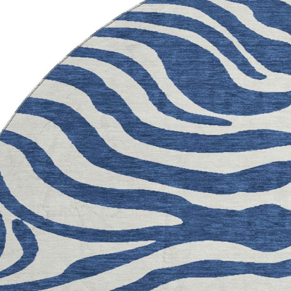 HomeRoots 8' Navy Blue and Ivory Animal Print Washable Round Rug with UV Protection for Stylish Spaces 681782