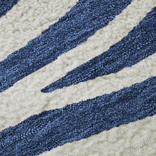 HomeRoots 9' X 12' Stylish Navy Blue & Ivory Animal Print Area Rug - Washable, UV Protected, Easy Care Design 681784