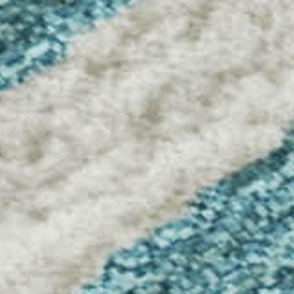 HomeRoots 8' X 10' Stylish Teal & Ivory Animal Print Area Rug - Washable, UV Protected, Family-Friendly Design! 681813