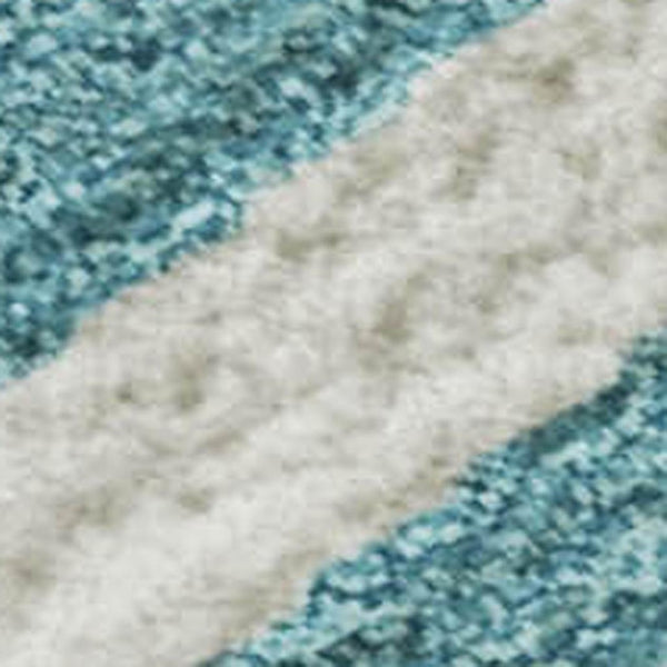 HomeRoots 9' X 12' Teal and Ivory Animal Print Area Rug - Washable, UV Protected, Perfect for Families! 681814