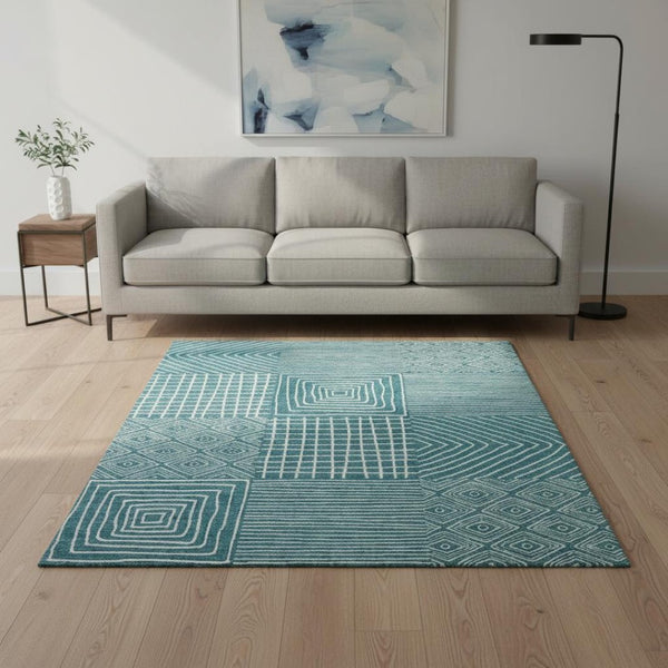 HomeRoots 5' X 8' Teal and Ivory Geometric Area Rug – Durable, Washable, UV-Protected for Modern Spaces 681931