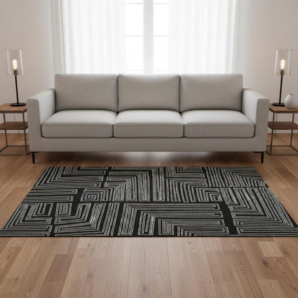 HomeRoots 5' X 8' Stylish Black and Ivory Geometric Washable Area Rug - Durable, UV Protected, Perfect for Families 681949