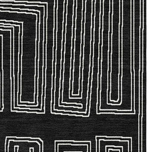 HomeRoots 5' X 8' Stylish Black and Ivory Geometric Washable Area Rug - Durable, UV Protected, Perfect for Families 681949