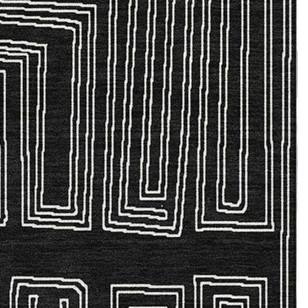 HomeRoots 5' X 8' Stylish Black and Ivory Geometric Washable Area Rug - Durable, UV Protected, Perfect for Families 681949