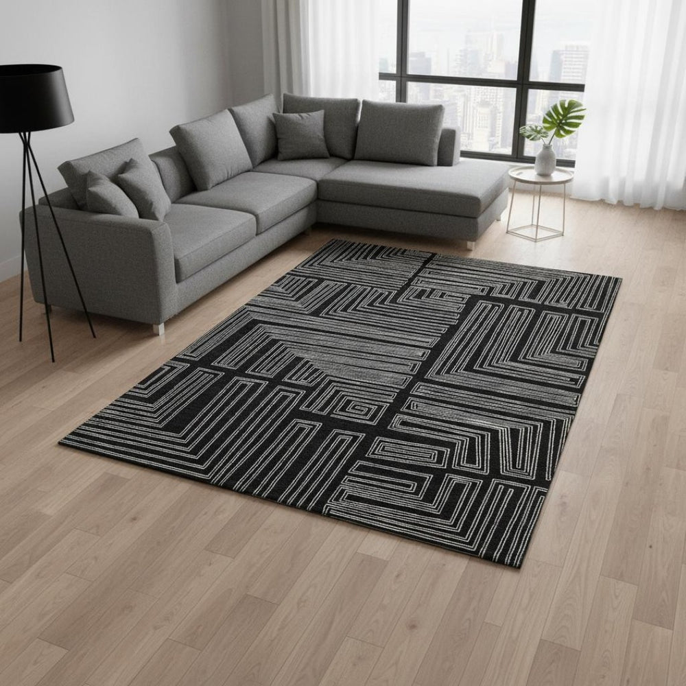HomeRoots 8' X 10' Black And Ivory Geometric Washable Area Rug - Durable, UV-Protected, Perfect for High-Traffic Spaces 681951