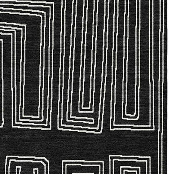 HomeRoots 8' X 10' Black And Ivory Geometric Washable Area Rug - Durable, UV-Protected, Perfect for High-Traffic Spaces 681951