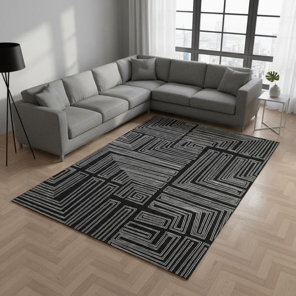 HomeRoots 9' X 12' Modern Black and Ivory Geometric Washable Area Rug with UV Protection for High-Traffic Spaces 681952