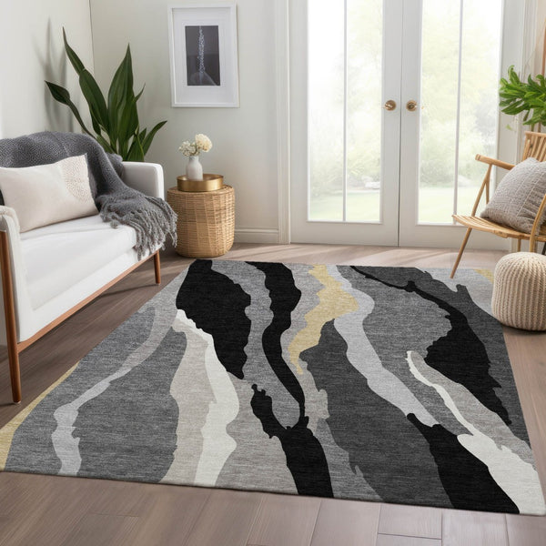 HomeRoots 10' X 14' Black Gold Ivory Abstract Area Rug – Stylish, Washable, UV-Resistant for High-Traffic Areas 682097