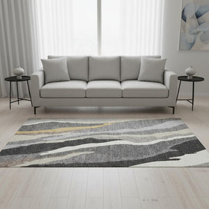 HomeRoots 5' X 8' Abstract Gray Gold Charcoal Area Rug - Washable, UV Protected, Ideal for Modern Spaces 682123