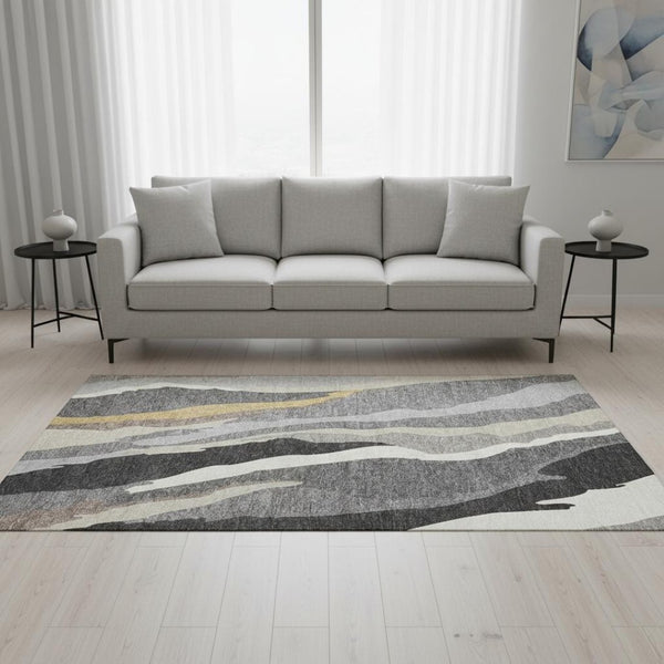 HomeRoots 5' X 8' Abstract Gray Gold Charcoal Area Rug - Washable, UV Protected, Ideal for Modern Spaces 682123