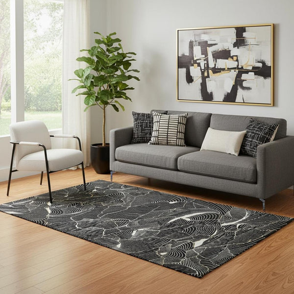 HomeRoots 5' X 8' Black Ivory Gold Abstract Area Rug - Durable, Washable, UV Protected for Modern Spaces 682183