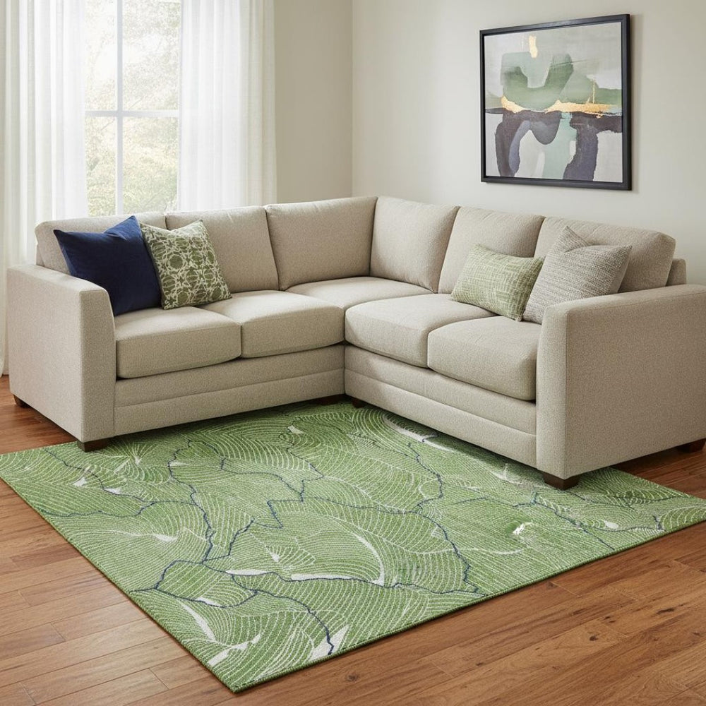 HomeRoots 10' X 14' Abstract Area Rug in Green, Ivory & Navy - Washable, UV Protected, Perfect for High-Traffic Spaces 682205