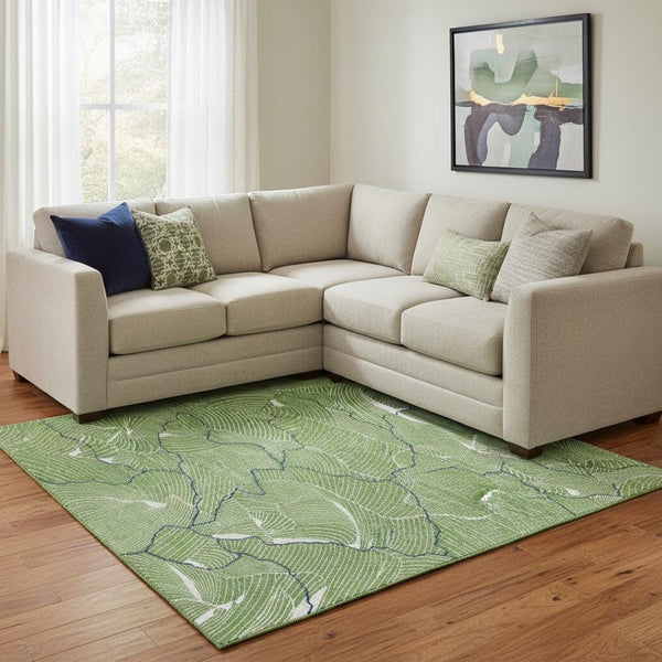 HomeRoots 10' X 14' Abstract Area Rug in Green, Ivory & Navy - Washable, UV Protected, Perfect for High-Traffic Spaces 682205