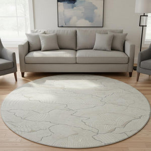 HomeRoots 8' Ivory Taupe and Gray Abstract Round Rug - Washable, UV Resistant, Stylish for High-Traffic Areas 682220