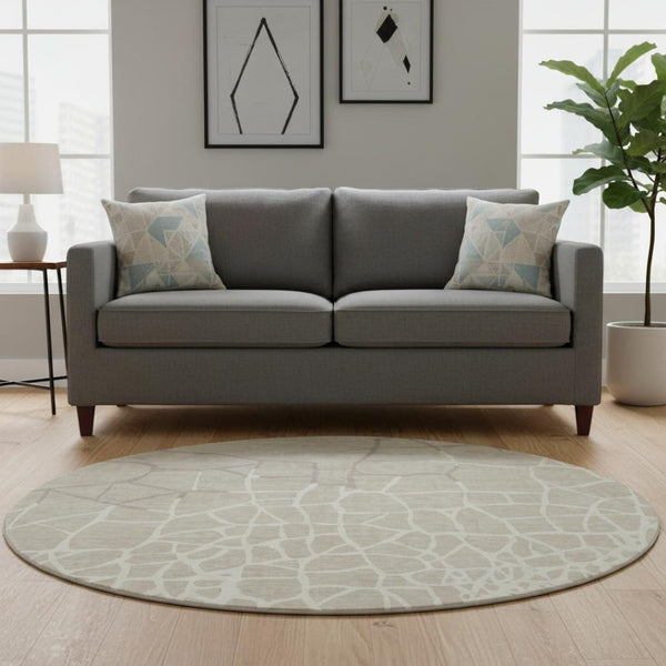 HomeRoots 8' Beige Ivory and Taupe Abstract Geometric Round Rug - Washable, UV Protected, Pet-Friendly Design 682250