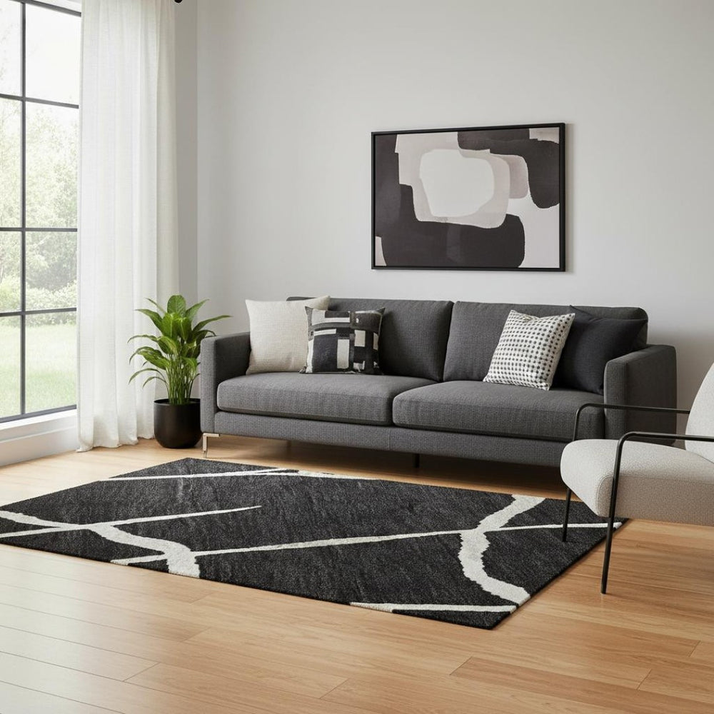 HomeRoots 5' X 8' Washable Black and Ivory Geometric Area Rug - Modern Style, UV Protected, Easy-Care Design! 682255