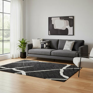 HomeRoots 5' X 8' Washable Black and Ivory Geometric Area Rug - Modern Style, UV Protected, Easy-Care Design! 682255
