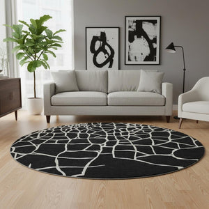 HomeRoots 8' Black And Ivory Abstract Geometric Round Rug - Washable, UV Protected, Non-Slip for Active Homes 682256