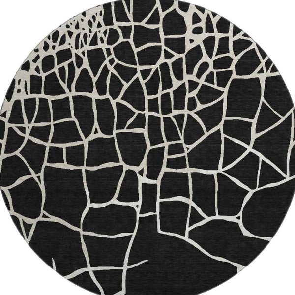 HomeRoots 8' Black And Ivory Abstract Geometric Round Rug - Washable, UV Protected, Non-Slip for Active Homes 682256
