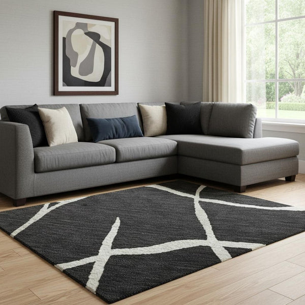HomeRoots 8' X 10' Black and Ivory Abstract Geometric Area Rug - Durable, Stain-Resistant & UV Protected Design 682257