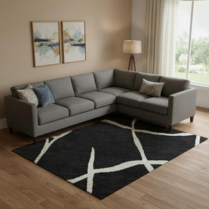 HomeRoots 9' X 12' Black and Ivory Abstract Geometric Area Rug - Durable, Washable with UV Protection & Style! 682258