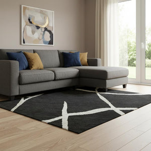HomeRoots 10' X 14' Black and Ivory Abstract Geometric Area Rug - Washable, UV Protected, Durable & Stylish! 682259