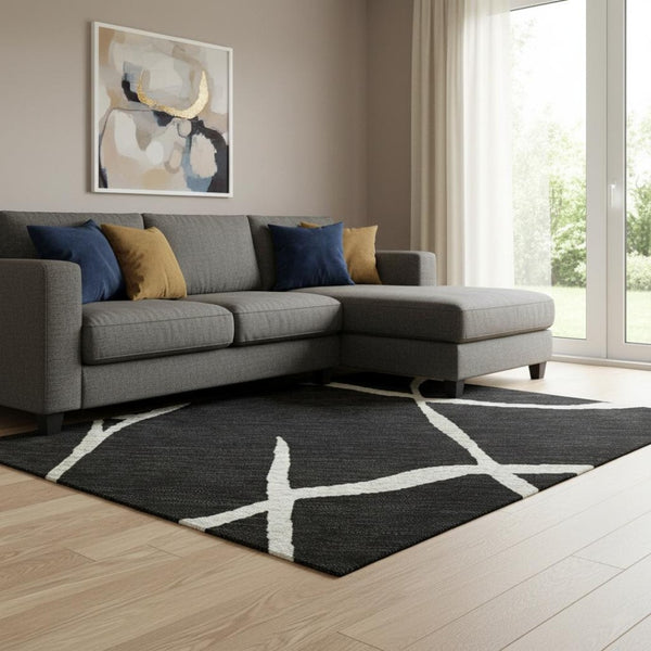 HomeRoots 10' X 14' Black and Ivory Abstract Geometric Area Rug - Washable, UV Protected, Durable & Stylish! 682259