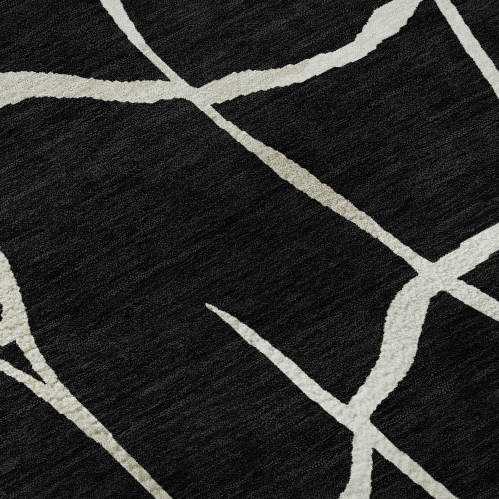 HomeRoots 10' X 14' Black and Ivory Abstract Geometric Area Rug - Washable, UV Protected, Durable & Stylish! 682259