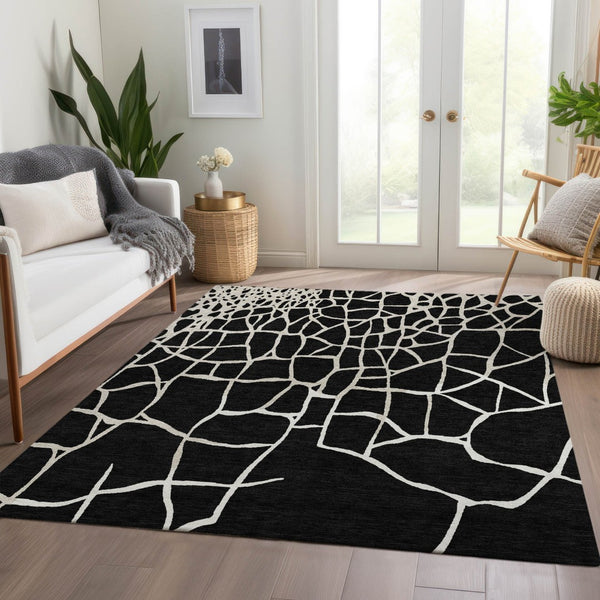 HomeRoots 10' X 14' Black and Ivory Abstract Geometric Area Rug - Washable, UV Protected, Durable & Stylish! 682259