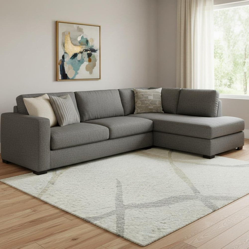 HomeRoots 10' X 14' Ivory Taupe & Gray Abstract Area Rug - Washable, UV-Protected for High-Traffic Spaces 682289