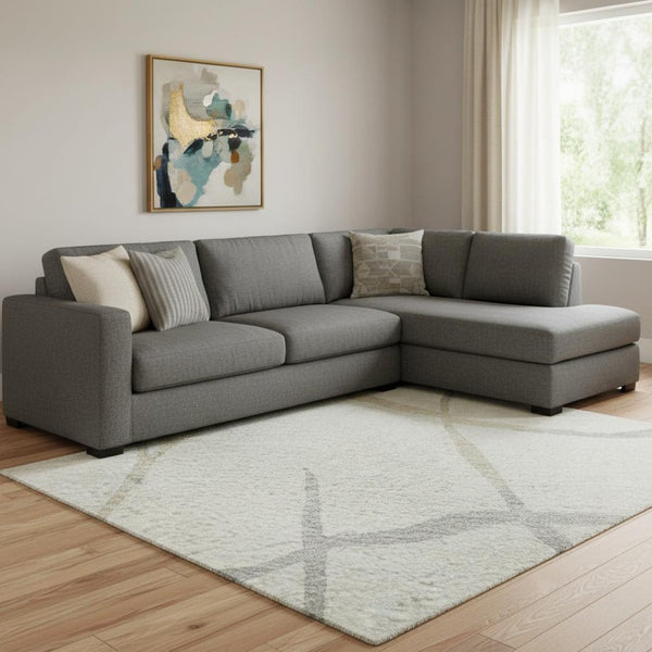 HomeRoots 10' X 14' Ivory Taupe & Gray Abstract Area Rug - Washable, UV-Protected for High-Traffic Spaces 682289